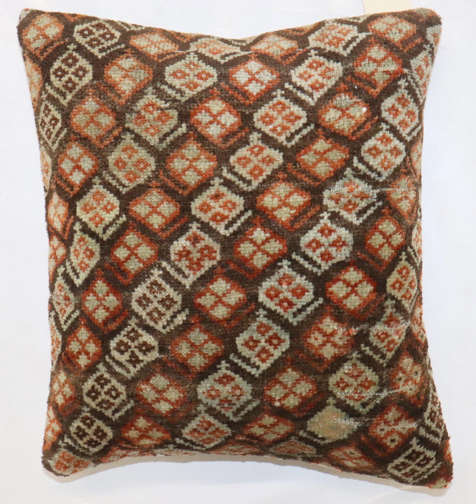 Persian Kurd Rug Pillow Brown 1' 4" x 1' 6": Persian Kurd Rug Pillow Brown 1' 4" x 1' 6" Decorative pillow made from an early 20th century Persian Kurd rug. This pre-owned piece offers the character of a vintage textile in a pillow form. Specifi