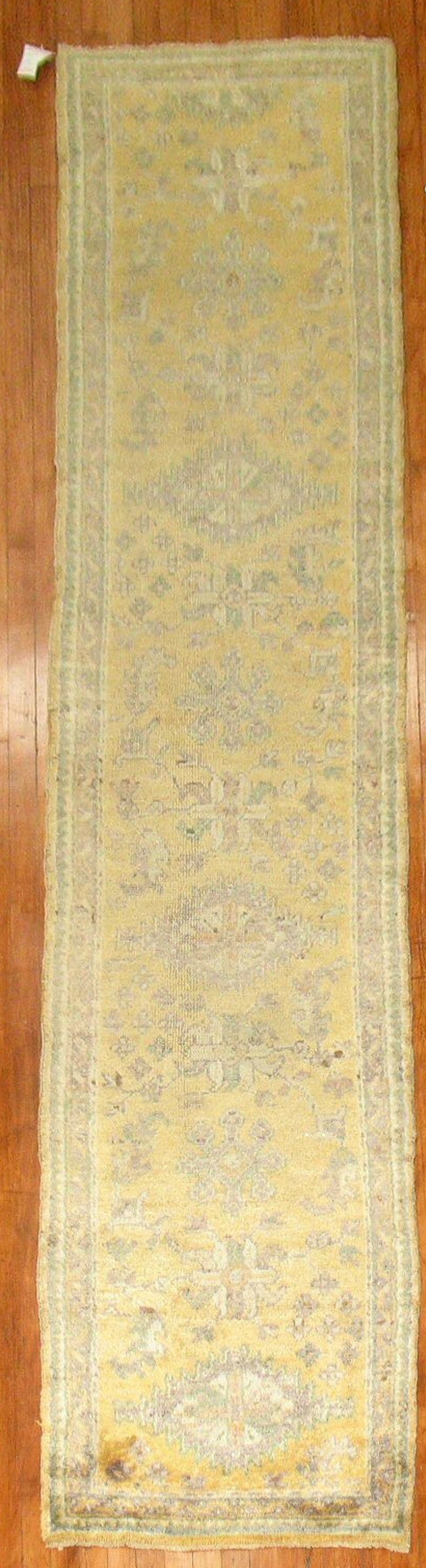 2' 6" x 11' Turkish Oushak rug runner in yellow: 2' 6" x 11' Turkish Oushak rug runner in yellow Early 20th century antique Turkish Oushak runner in a yellow colorway. This pre-owned rug is identified as an Oushak runner. Specifications Type: Oushak