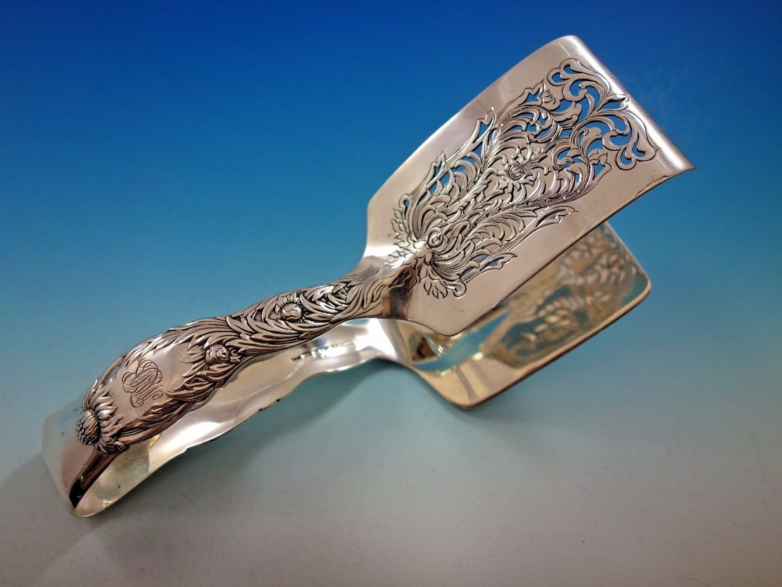 Sterling Silver Asparagus Tongs Chrysanthemum Pattern by Tiffany & Co Monogrammed: Sterling Silver Asparagus Tongs Chrysanthemum Pattern by Tiffany & Co Monogrammed These sterling silver asparagus tongs are crafted by Tiffany & Co. in the Chrysanthemum pattern, featuring a rounded, 