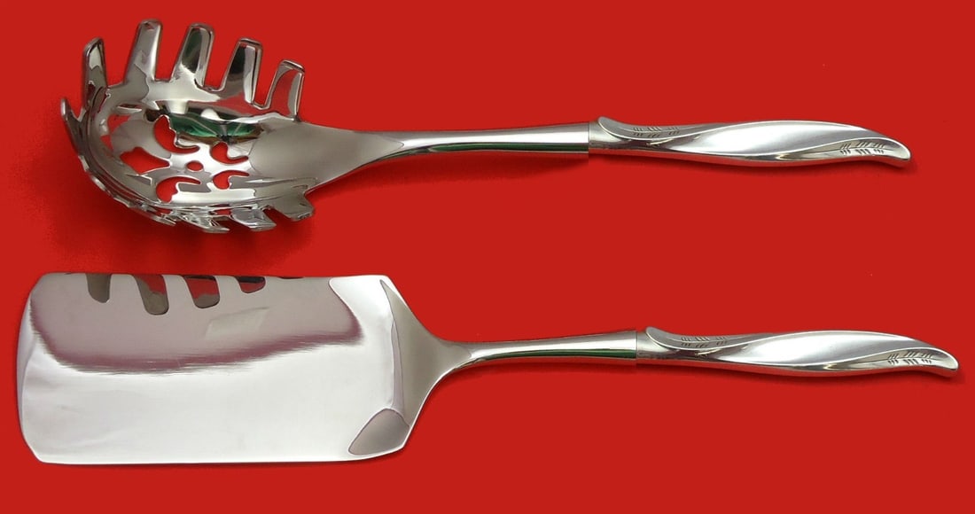 International Sterling Pine Spray 2pc Pasta Serving Set: International Sterling Pine Spray 2pc Pasta Serving Set This exquisite 2-piece Italian pasta server set, crafted by International Sterling, features a beautiful pine spray design. Made from sterling s