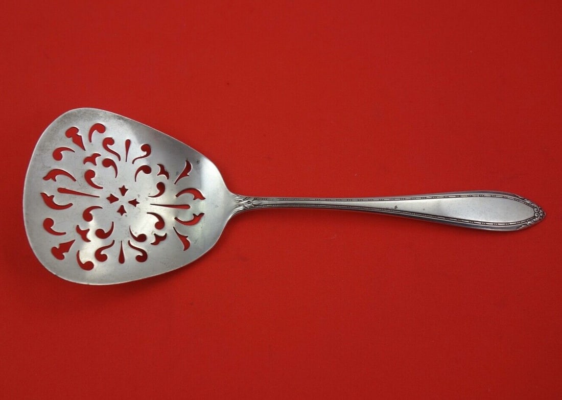 International Sterling Silver Lady Betty Tomato Server 7 3/4 inches: International Sterling Silver Lady Betty Tomato Server 7 3/4 inches Enhance your dining experience with the exquisite Lady Betty Tomato Server by International Sterling Silver. This elegant serving pi