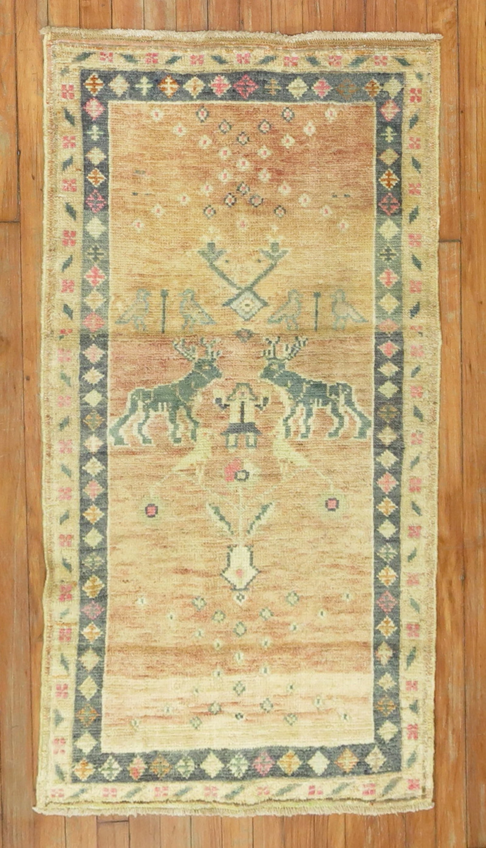 2' 5" x 4' 6" Anatolian pictorial throw rug with deer: 2' 5" x 4' 6" Anatolian pictorial throw rug with deer Mid-20th century Turkish pictorial throw rug featuring a deer motif. This pre-owned small Anatolian rug offers a decorative pictorial design in a 