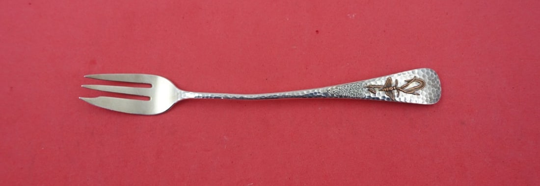 Gorham Applied Metals Sterling Cocktail Fork #3 with Moth 6 1/8": Gorham Applied Metals Sterling Cocktail Fork #3 with Moth 6 1/8" This exquisite cocktail fork, crafted by Gorham, features a remarkable design from the Applied Metals pattern. Made from sterling silve