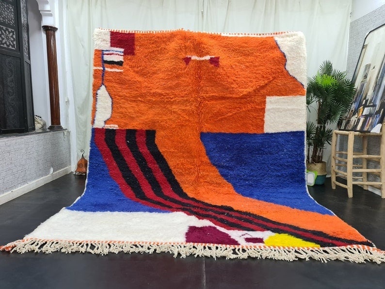 Large Abstract Handmade Berber Wool Rug from Morocco: Large Abstract Handmade Berber Wool Rug from Morocco Transform your living space with this large, stunning abstract handmade Berber wool rug. Crafted by skilled local Berber women weavers in the Atlas