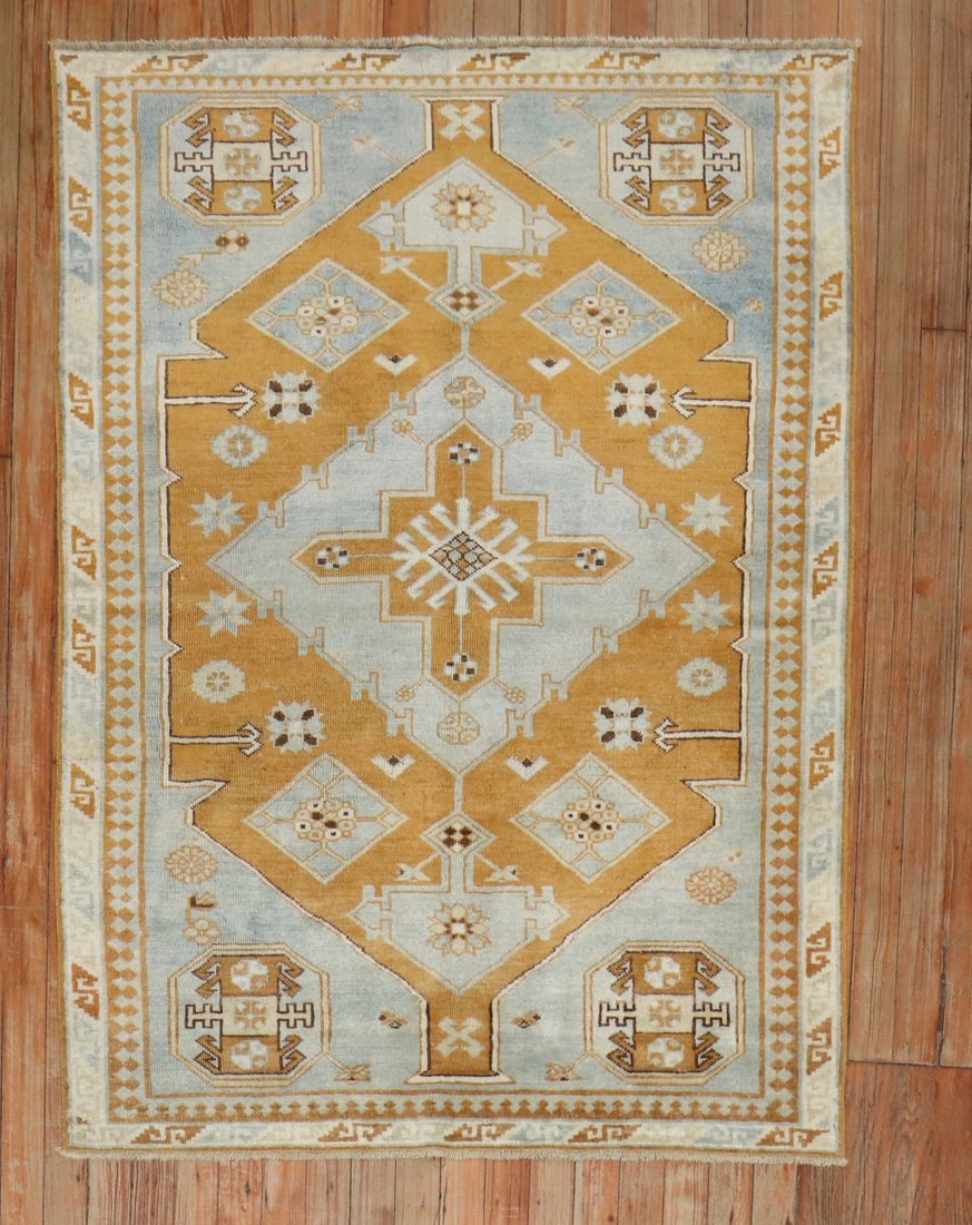 3' 4" x 4' 6" Caucasian Kazak rug bronze and blue: 3' 4" x 4' 6" Caucasian Kazak rug bronze and blue Vintage Caucasian Kazak rug from the 3rd quarter of the 20th century, featuring a bronze and blue color palette. This pre-owned small square rug prese
