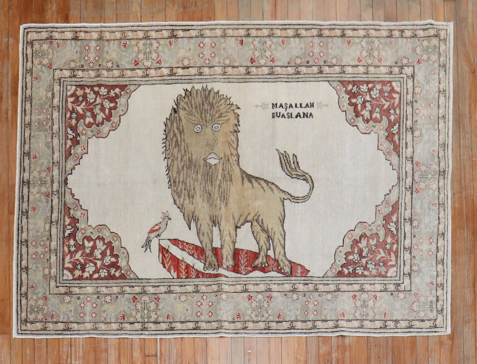4' 7" x 6' 9" Vintage Turkish Keysari Pictorial Rug with Lion: 4' 7" x 6' 9" Vintage Turkish Keysari Pictorial Rug with Lion One-of-a-kind mid 20th century Turkish pictorial rug featuring a large lion and small bird on a white field with a silver floral border. T
