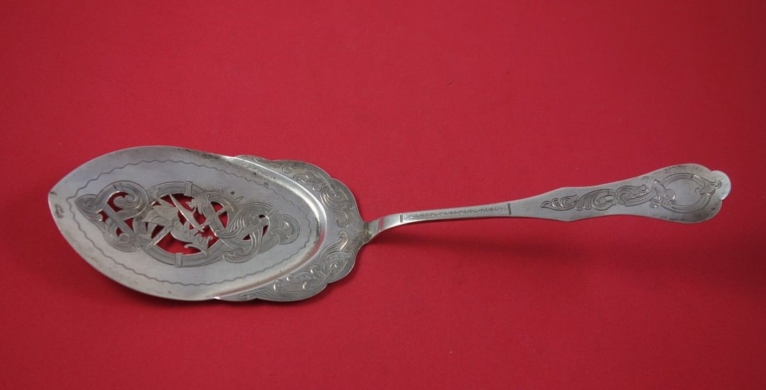 Norwegian .830 Silver Pie Server Flat Handle Pierced Design 10 3/4": Norwegian .830 Silver Pie Server Flat Handle Pierced Design 10 3/4" This elegant Norwegian pie server features a flat handle with a pierced design and bright-cut detailing, crafted from high-quality
