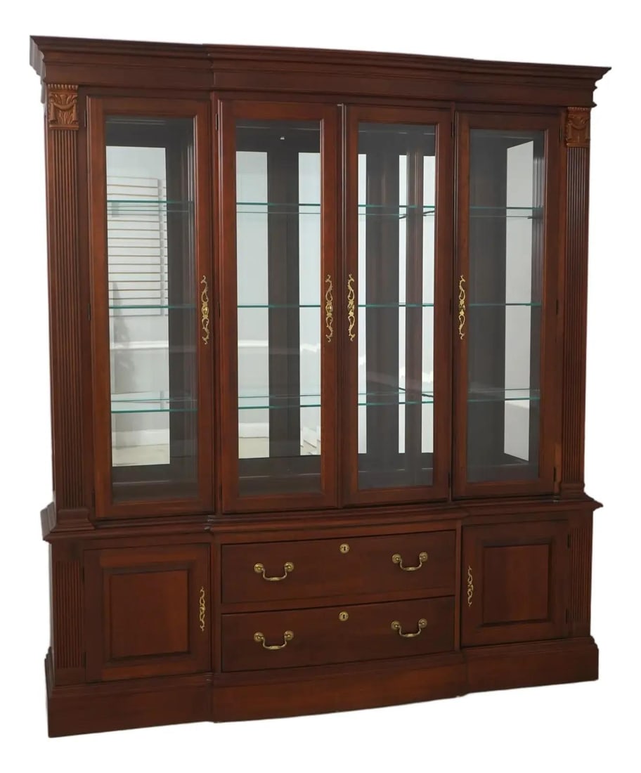 Georgian Revival Cherry Breakfront Cabinet with Glass Shelves and Mirrored Back: Georgian Revival Cherry Breakfront Cabinet with Glass Shelves and Mirrored Back This Pennsylvania House china cabinet features a Georgian Revival style crafted from cherry wood. The cabinet includes g