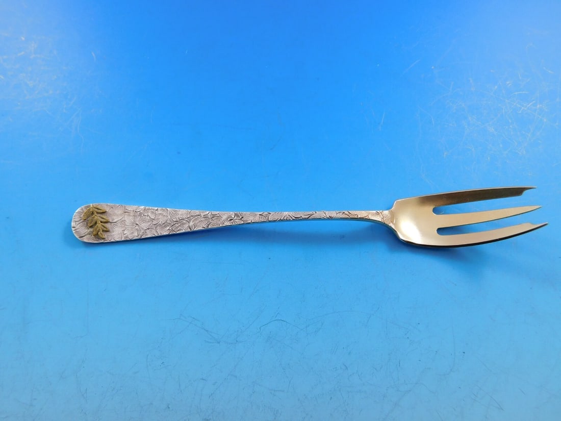 Dominick & Haff Sterling Silver Cocktail Fork Gold Leaf 3 7/8": Dominick & Haff Sterling Silver Cocktail Fork Gold Leaf 3 7/8" Discover this exquisite Hammered & Applied Cocktail Fork crafted by Dominick & Haff, measuring 3 7/8". This sterling silver fork features