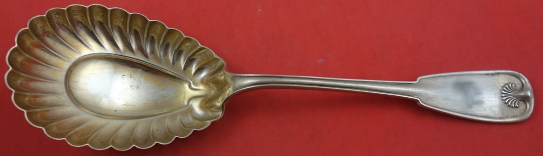 Tiffany & Co. Palm Sterling Silver Berry Spoon Goldwashed Fluted 9 1/4": Tiffany & Co. Palm Sterling Silver Berry Spoon Goldwashed Fluted 9 1/4" This exquisite serving spoon is crafted by Tiffany & Co. in the elegant Palm pattern. Made of high-quality sterling silver, it f