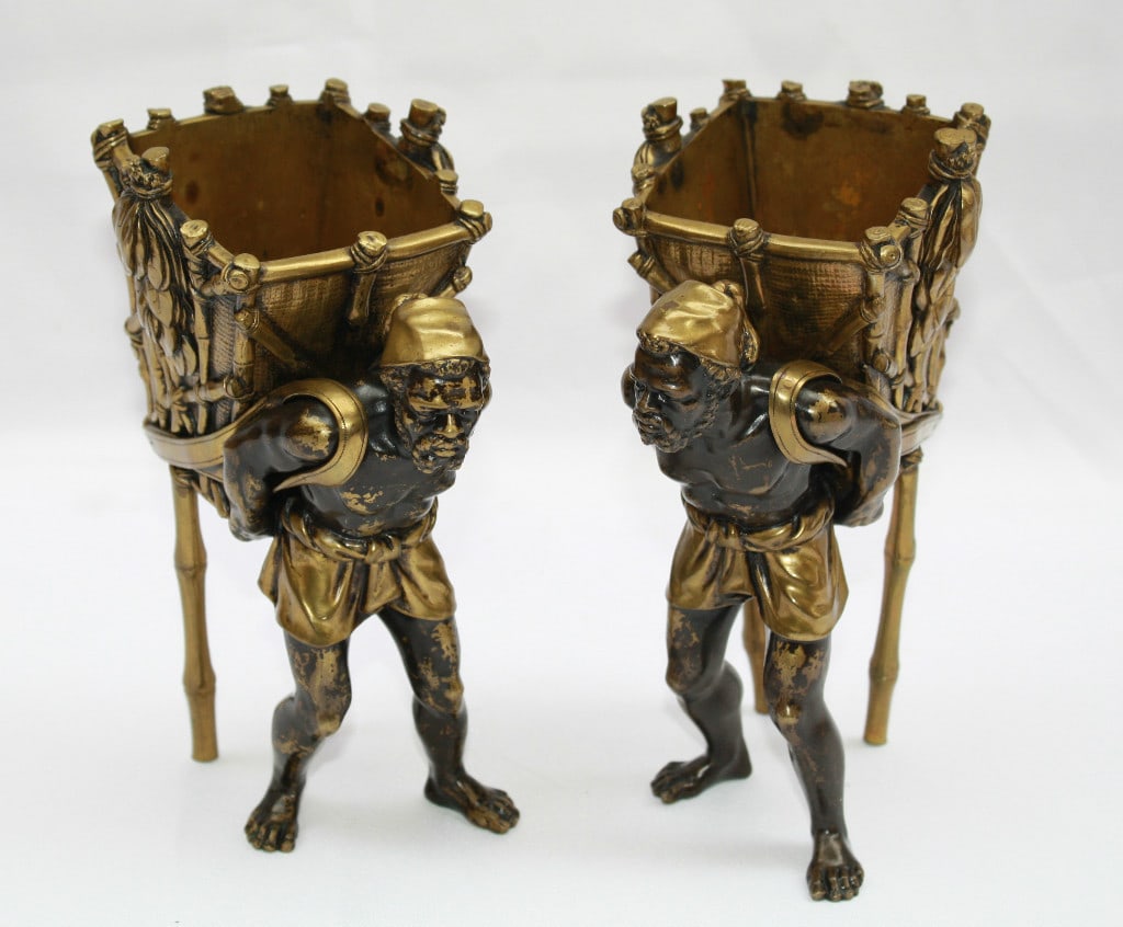 19th Century Austrian Patinated Gilt Bronze Figural Vases Pair: 19th Century Austrian Patinated Gilt Bronze Figural Vases Pair This exquisite pair of 19th-century Austrian Orientalist figural vases or candy dishes is crafted from patinated and gilt bronze. Each va