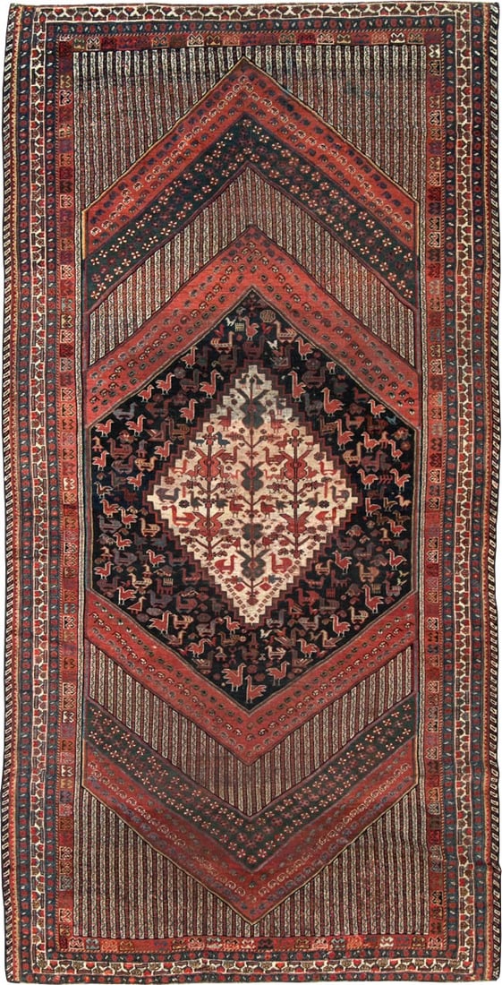 19th Century Persian Shiraz Gallery Rug 5' 3" x 10' 3": 19th Century Persian Shiraz Gallery Rug 5' 3" x 10' 3" A 19th century tribal Persian Shiraz gallery rug with a central diamond motif and geometric design elements. This pre-owned rug reflects the trad