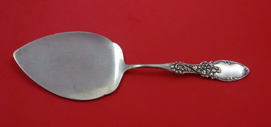 Amston Tyrolean Sterling Silver Pie Server Flat Handle 10 1/8 Inches: Amston Tyrolean Sterling Silver Pie Server Flat Handle 10 1/8 Inches Presenting the Tyrolean pie server by Amston, crafted entirely from sterling silver. This exquisite cake/pie server features a flat