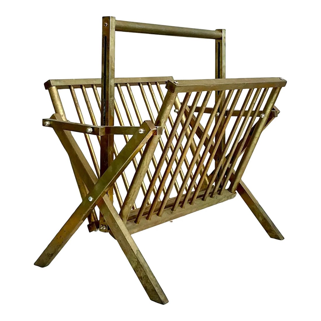 Vintage Modernist Brass Magazine Rack with X-Frame Design: Vintage Modernist Brass Magazine Rack with X-Frame Design Enhance your living space with this striking Vintage Modernist Brass Newspaper Rack, a perfect blend of functionality and artistic design. Cra