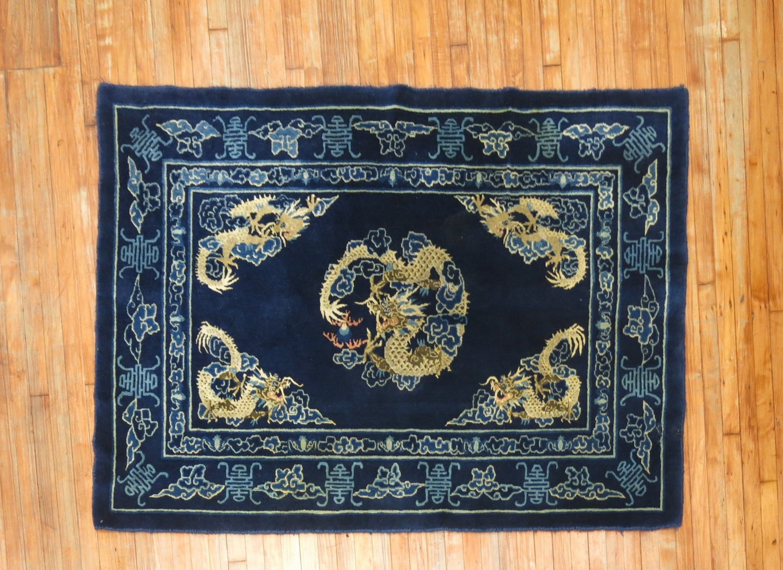 4' 1" x 6' 1" Chinese Peking accent rug with dragon motif: 4' 1" x 6' 1" Chinese Peking accent rug with dragon motif Mid-20th century Chinese Peking rug with a full pile and dragon motif design. This pre-owned accent rug is classified as a Chinese pictorial p