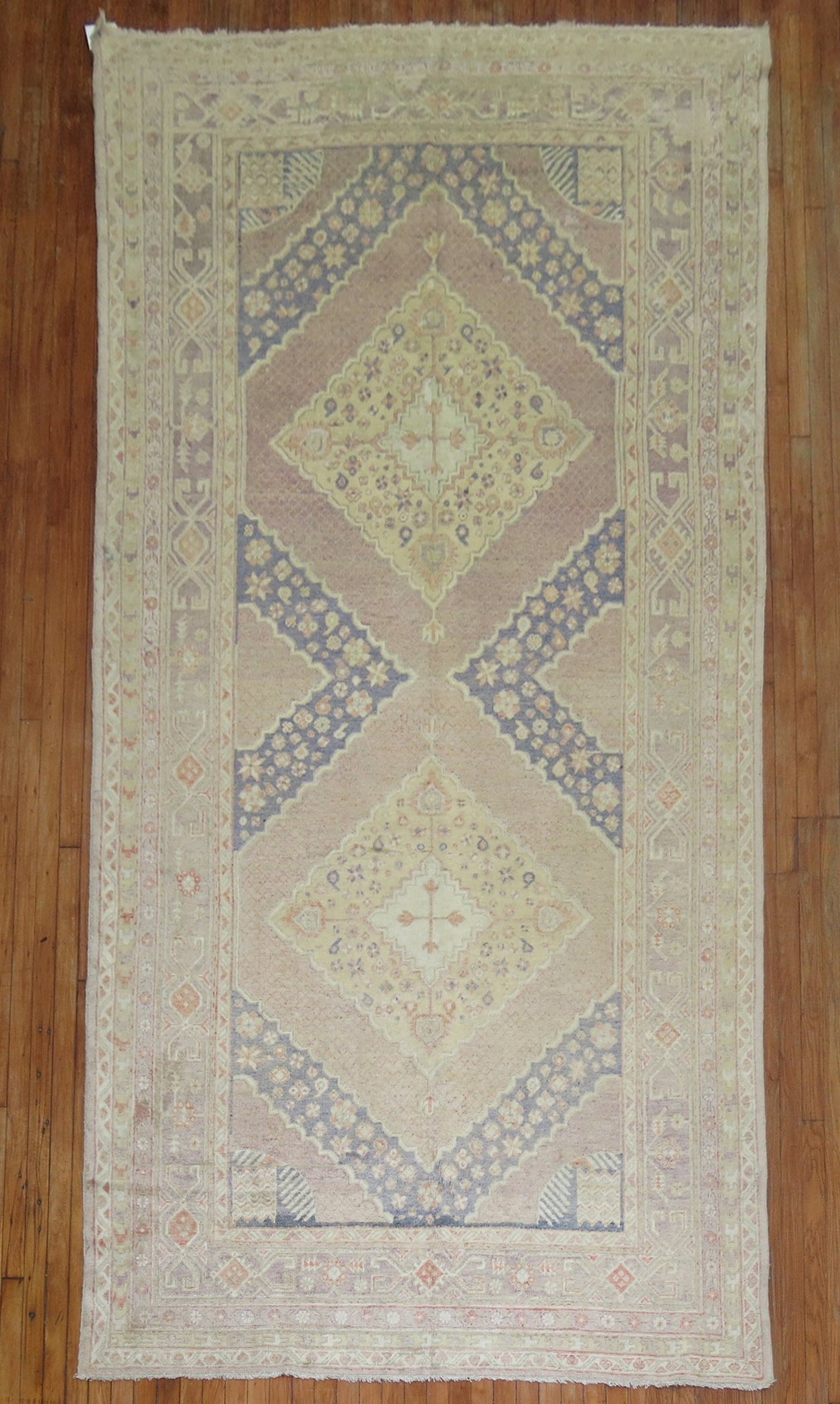 6' x 12' Antique Khotan Gallery Rug in Lavender: 6' x 12' Antique Khotan Gallery Rug in Lavender Early 20th-century Khotan Samarkand rug in an antique lavender colorway. This pre-owned gallery-size rug is identified as a Khotan type. Specifications 