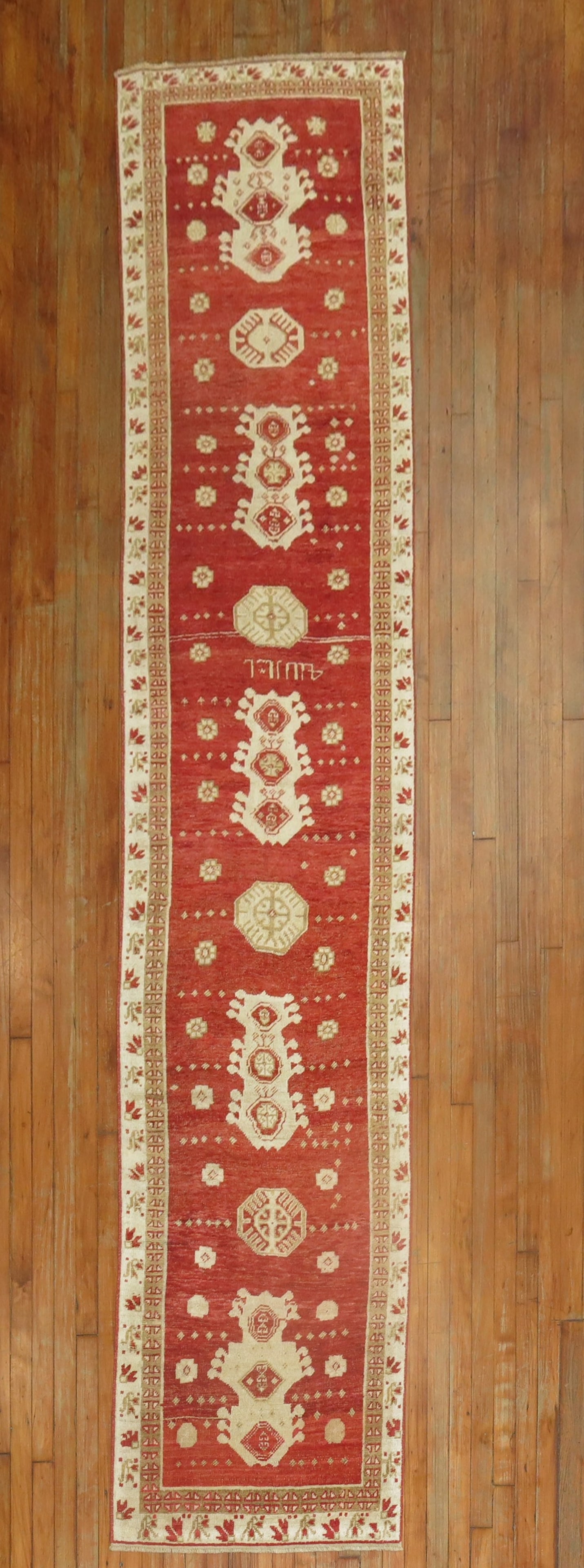 2' 6" x 11' 9" Turkish Oushak runner in red: 2' 6" x 11' 9" Turkish Oushak runner in red Early 20th century Turkish Oushak runner with a vibrant red field and traditional patterned design. This pre-owned rug is identified as an Oushak runner. Sp