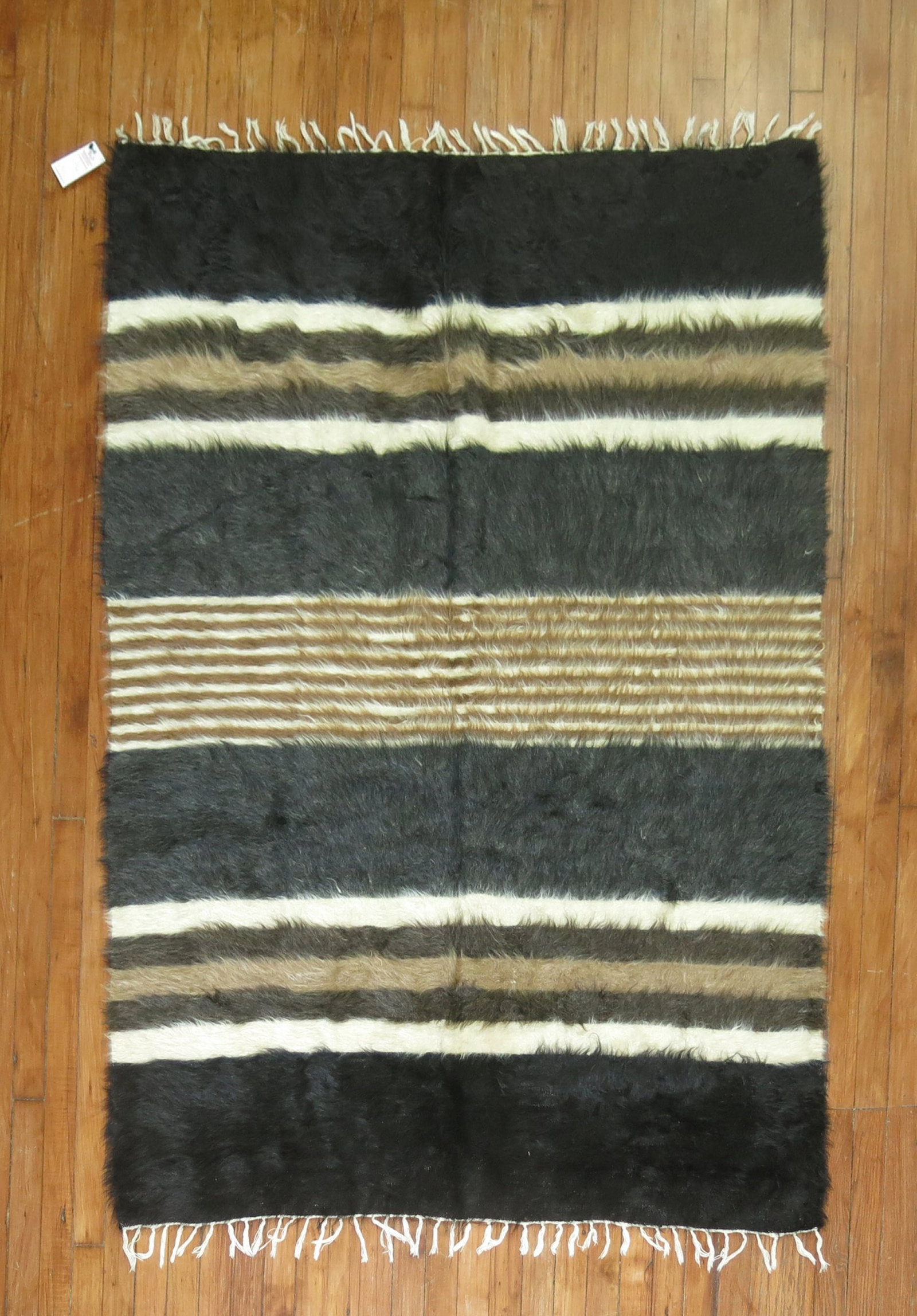 4' 2" x 6' Mid Century Turkish Kilim Mohair Accent Rug: 4' 2" x 6' Mid Century Turkish Kilim Mohair Accent Rug Mid-century Turkish mohair rug with a striped design and accent-size format. This pre-owned rug is described as Angora, Kilim, and Mohair, offeri