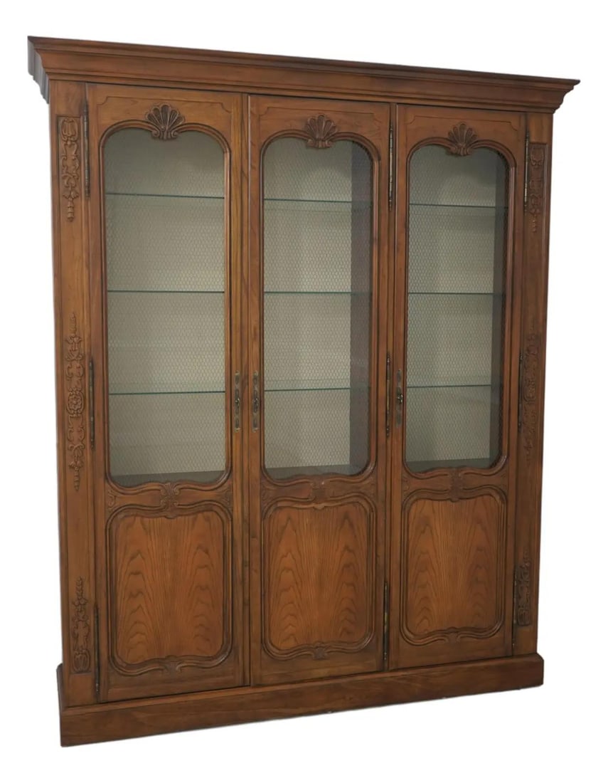 Large Oak Display Cabinet in Country French Style with Glass Shelves and Lighting: Large Oak Display Cabinet in Country French Style with Glass Shelves and Lighting This Baker Country French oak china cabinet features a classic Country French style with a large, impressive presence.