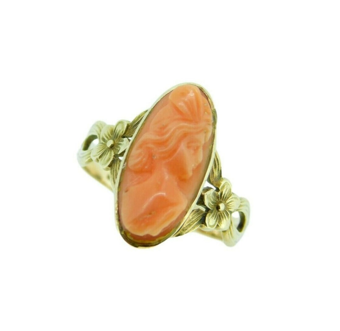 10k Gold Art Nouveau Coral Cameo Ring Vintage Floral Design: 10k Gold Art Nouveau Coral Cameo Ring Vintage Floral Design This exquisite Art Nouveau ring features a stunning natural coral cameo in an elegant yellow gold setting. The oval-shaped coral, measuring 