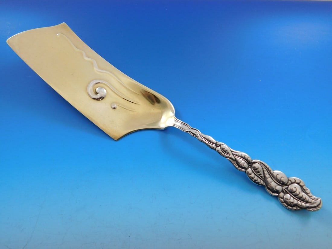 Tiffany & Co Ailanthus Sterling Silver Ice Cream Slice 12 Inch Goldwashed Blade: Tiffany & Co Ailanthus Sterling Silver Ice Cream Slice 12 Inch Goldwashed Blade This stunning ice cream slice from the renowned Ailanthus pattern by Tiffany & Co. is crafted from high-quality sterling