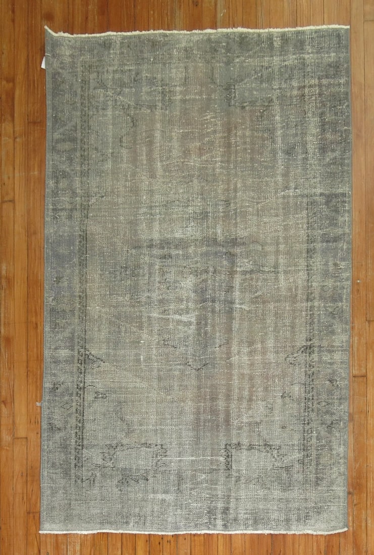 4' 4" x 6' 9" Turkish Overdye Accent Rug: 4' 4" x 6' 9" Turkish Overdye Accent Rug Mid 20th century Turkish overdye rug in an accent size. This pre-owned rectangular rug features a muted palette and subtle pattern consistent with the provided
