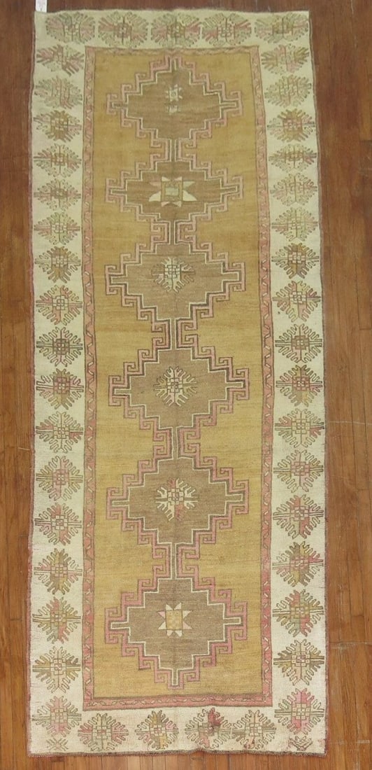 4' 6" x 12' 7" Anatolian Kars Gallery Runner: 4' 6" x 12' 7" Anatolian Kars Gallery Runner Turkish Kars gallery-size runner in brown and pink with an Anatolian design. Pre-owned. Specifications Origin: Turkish Region: Kars Type: Anatolian Categor
