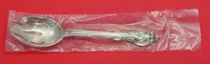Sterling Silver Pierced Serving Spoon La Scala Pattern Factory Sealed 8.75 Inch: Sterling Silver Pierced Serving Spoon La Scala Pattern Factory Sealed 8.75 Inch This Gorham La Scala sterling silver pierced serving spoon is original and un-used, still sealed in its factory sleeve. 