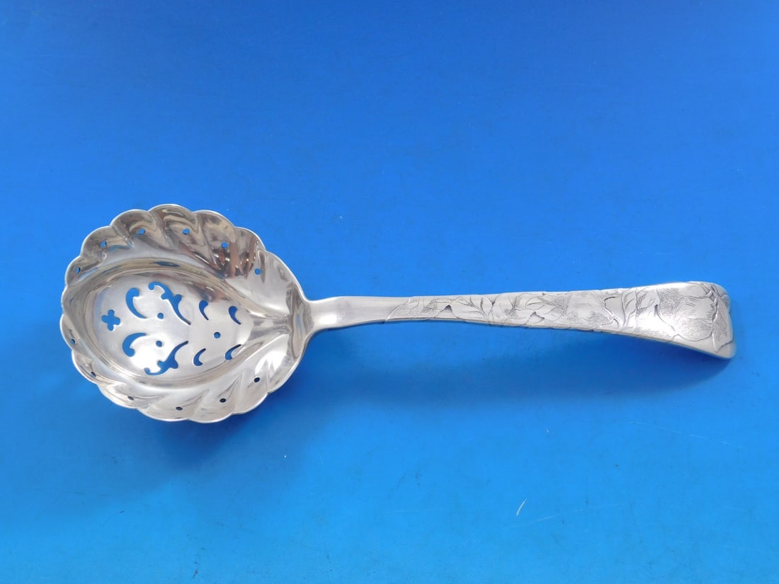 Tiffany & Co. Lap Over Edge Sterling Silver Sugar Sifter Pear Motif 6 7/8": Tiffany & Co. Lap Over Edge Sterling Silver Sugar Sifter Pear Motif 6 7/8" This exquisite sugar sifter showcases the elegant Lap Over Edge pattern acid etched by Tiffany & Co., crafted from high-quali