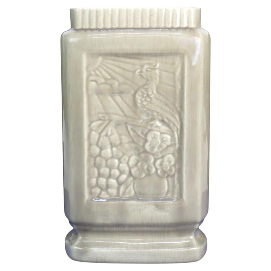 C1950 California Pottery Pillow Vase with Embossed Bird and Sunrise: C1950 California Pottery Pillow Vase with Embossed Bird and Sunrise A distinctive Mid-Century Modern pillow vase from California West Coast Pottery, dating to approximately 1950. It is crafted from po