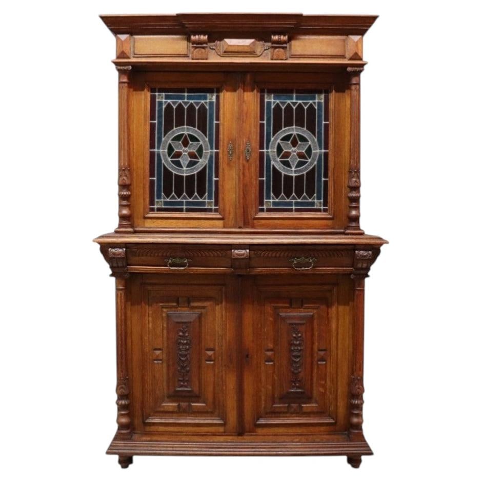 C1900 Continental Gothic Oak Court Cupboard with Leaded Stained Glass: C1900 Continental Gothic Oak Court Cupboard with Leaded Stained Glass Antique Continental Gothic court cupboard dating to approximately 1900. Crafted from carved oak, it features stained and leaded gl