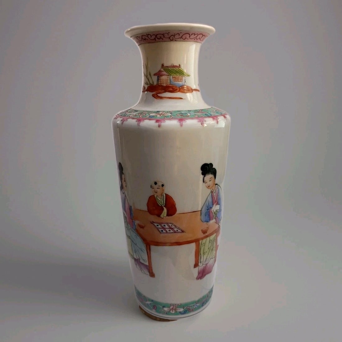 Chinese Republic Famille Rose Porcelain Vase 8 Inch Hand Painted: Chinese Republic Famille Rose Porcelain Vase 8 Inch Hand Painted Chinese Republic porcelain vase with a continuous hand-painted Famille Rose scene. The decoration depicts adults seated at a table, pos