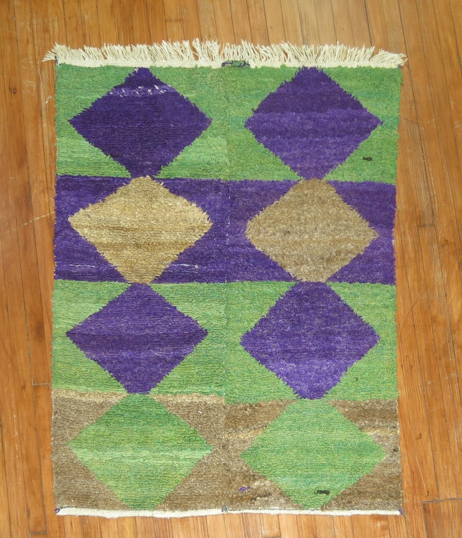3' 9" x 5' Geometric Konya Shag Rug in Green and Purple: 3' 9" x 5' Geometric Konya Shag Rug in Green and Purple Late 20th century Konya shag rug with a geometric design in purple and green. This pre-owned rug is categorized as a small square rug. Specifica