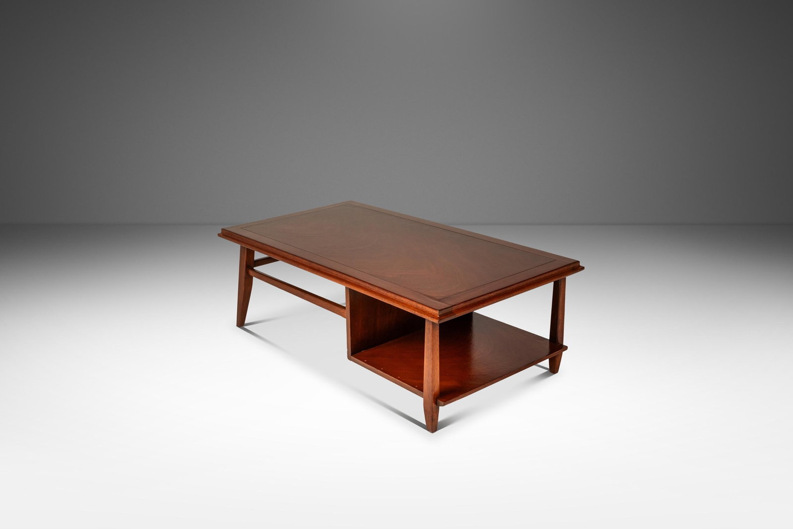 1960s Mid-Century Modern Mahogany Coffee Table USA: 1960s Mid-Century Modern Mahogany Coffee Table USA This exquisite Mid-Century Modern Angular Coffee Table, crafted in solid mahogany during the 1960s, is a true representation of the era's sophisticat