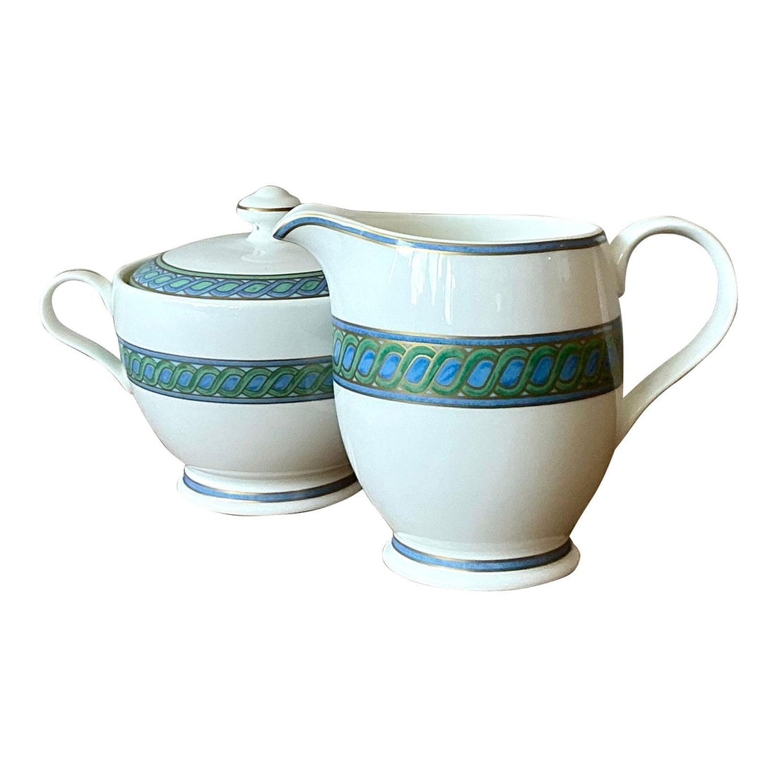 Pair of Torsada Silverplate Creamer and Lidded Sugar Bowl: Pair of Torsada Silverplate Creamer and Lidded Sugar Bowl This Christofle "Torsada" set includes a creamer and a lidded sugar bowl, both featuring the brand's signature twist design. Crafted from silv