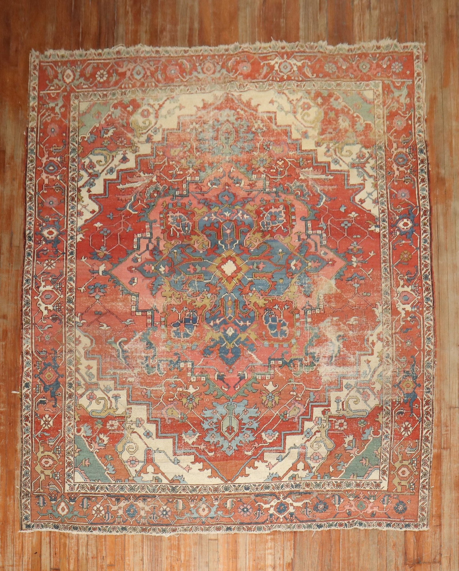 8' 8" x 11' 5" Late 19th Century Persian Serapi Rug: 8' 8" x 11' 5" Late 19th Century Persian Serapi Rug Late 19th century Persian Serapi rug with a worn, distressed appearance. This pre-owned room-size rug is identified as a Serapi/Heriz type and featu