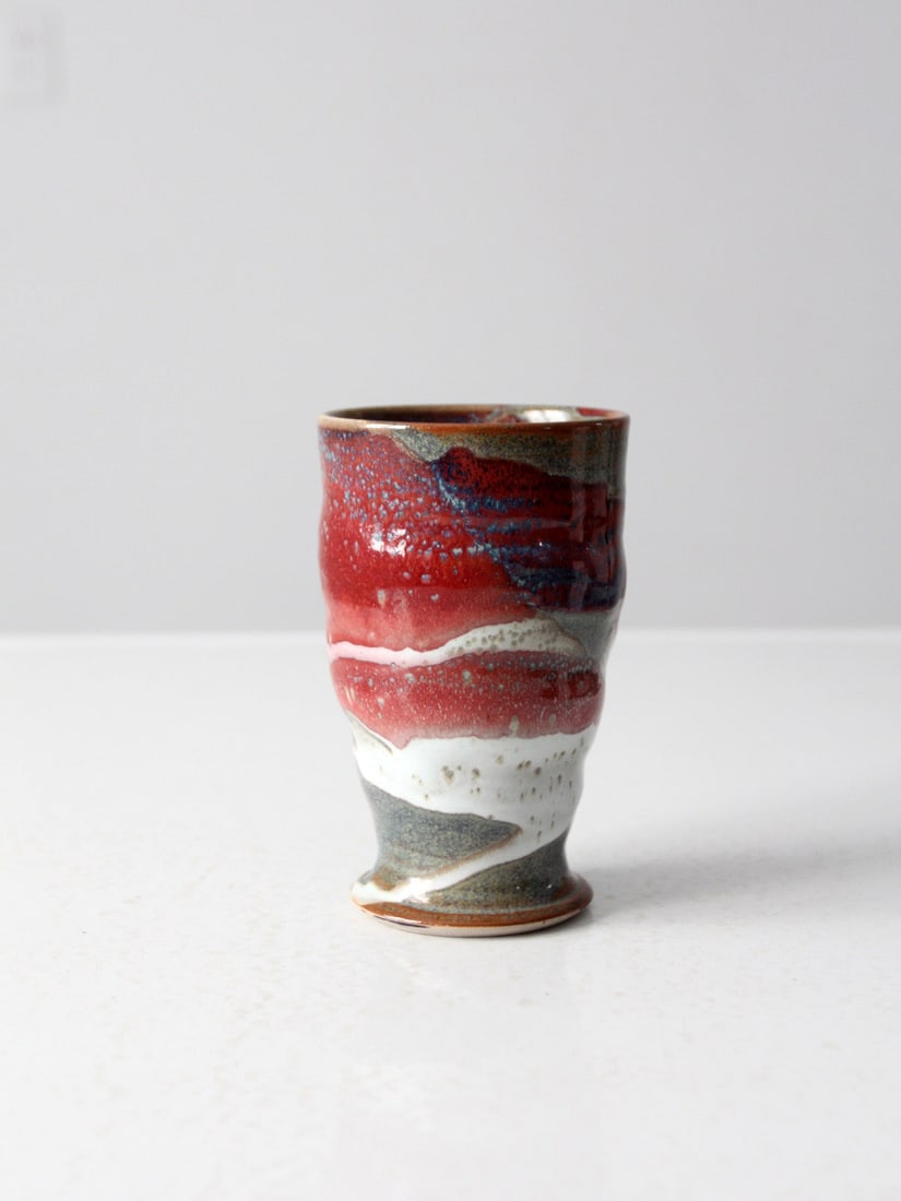 Handmade Vintage Studio Pottery Vase Red Gray Glaze Signed 5.875": Handmade Vintage Studio Pottery Vase Red Gray Glaze Signed 5.875" This exquisite vintage studio pottery tumbler vase showcases a captivating red, white, and gray glaze, making it a stunning statement 