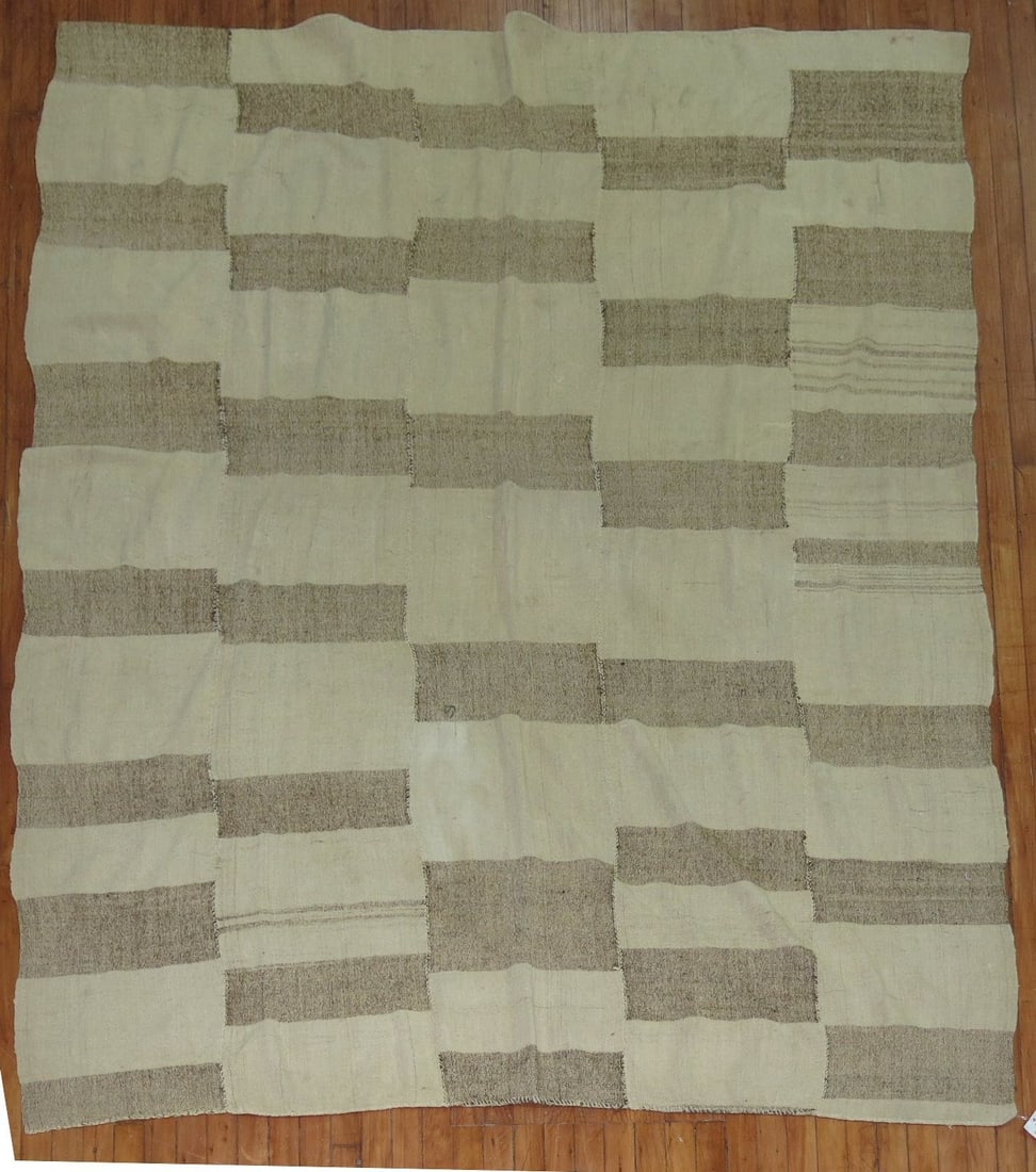 6' 5" x 8' 1" Mid 20th Century Turkish Kilim Rug: 6' 5" x 8' 1" Mid 20th Century Turkish Kilim Rug Mid-20th century Turkish kilim in a beige and brown color palette. This pre-owned rug features the flatwoven kilim style and offers a versatile, unders