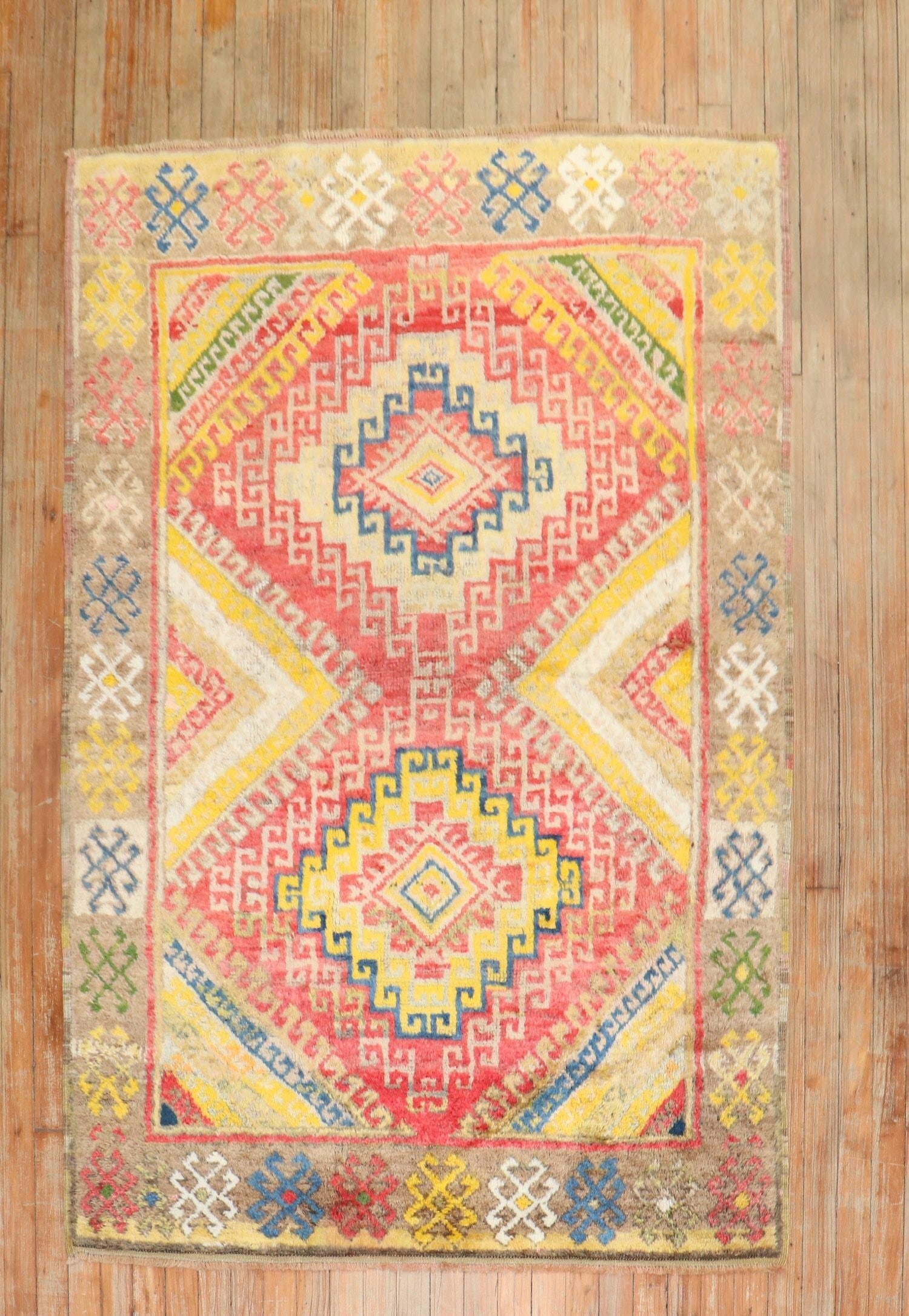 4' 1" x 6' Mid 20th Century Turkish Konya Accent Rug: 4' 1" x 6' Mid 20th Century Turkish Konya Accent Rug Vintage Turkish Konya rug featuring a high-pile construction and geometric design. This mid-20th century accent rug presents a colorful patterned l