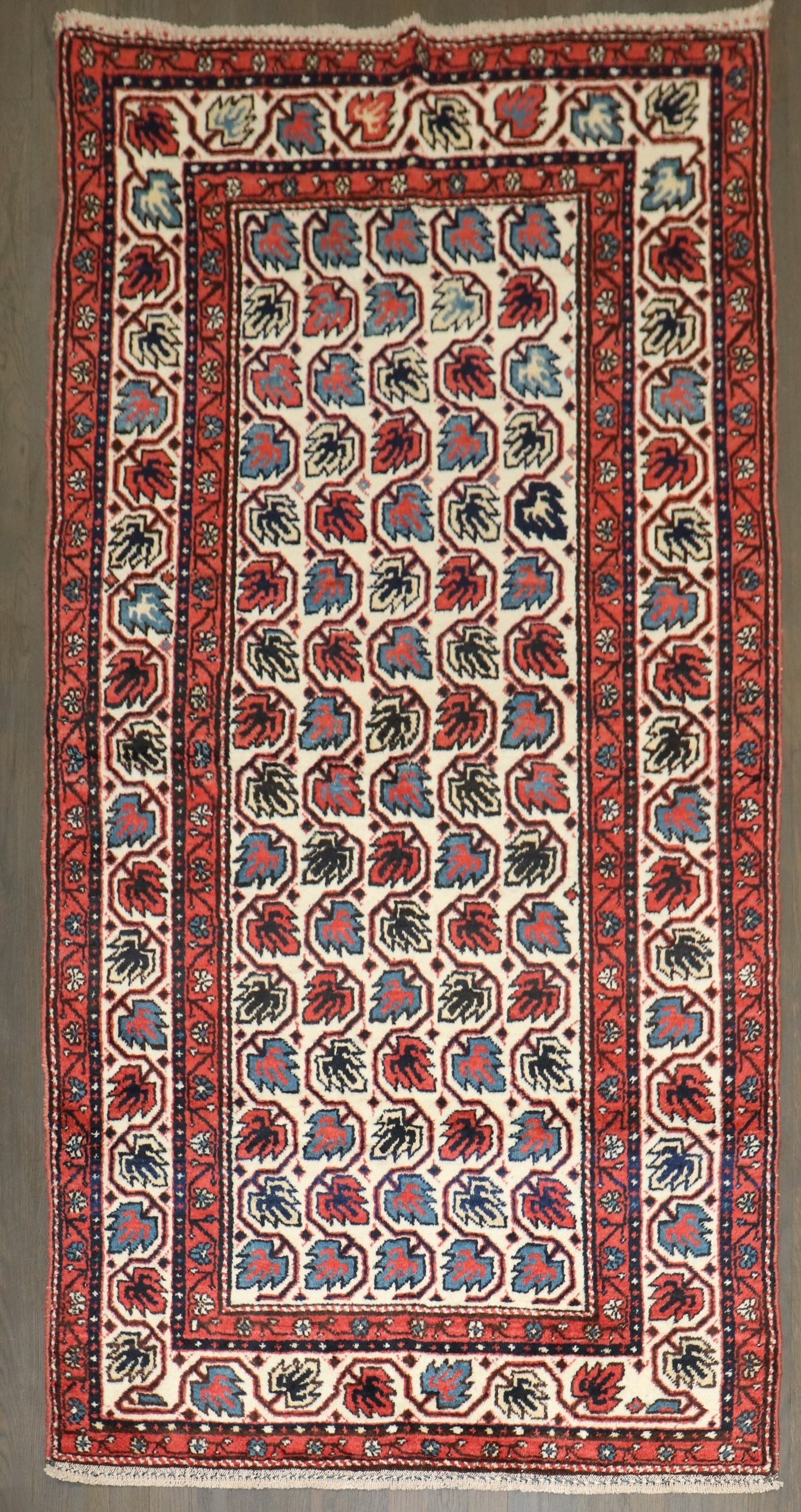 3' 5" x 6' 5" Northwest Persian leaf motif rug: 3' 5" x 6' 5" Northwest Persian leaf motif rug 1930s Northwest Persian rug featuring a leaf design on an ivory field. This pre-owned small rug offers a classic decorative look with traditional Persian