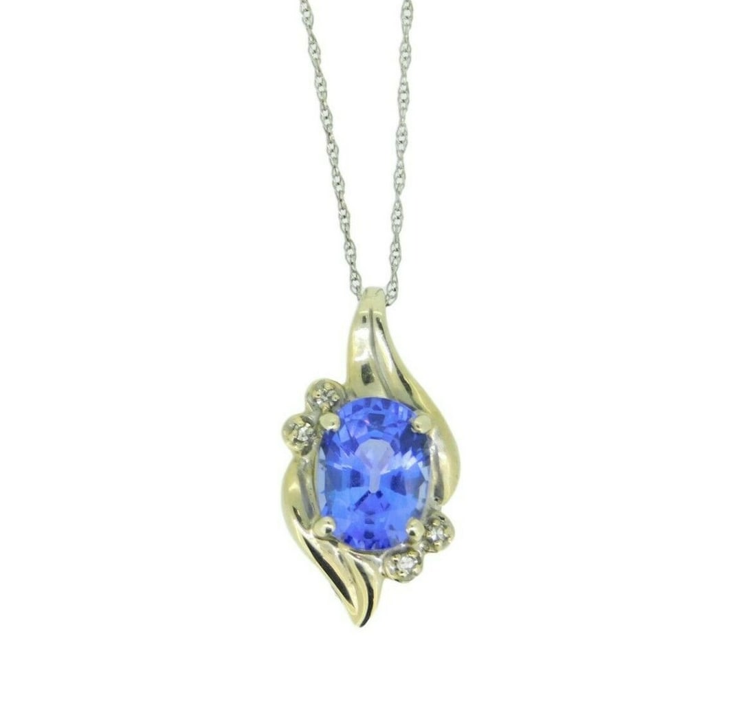 14k White Gold Oval 2.15ct Tanzanite Pendant Necklace with Diamonds: 14k White Gold Oval 2.15ct Tanzanite Pendant Necklace with Diamonds This 14k white gold pendant features a genuine natural oval tanzanite gemstone weighing 2.15 carats with a deep purplish-blue hue. A