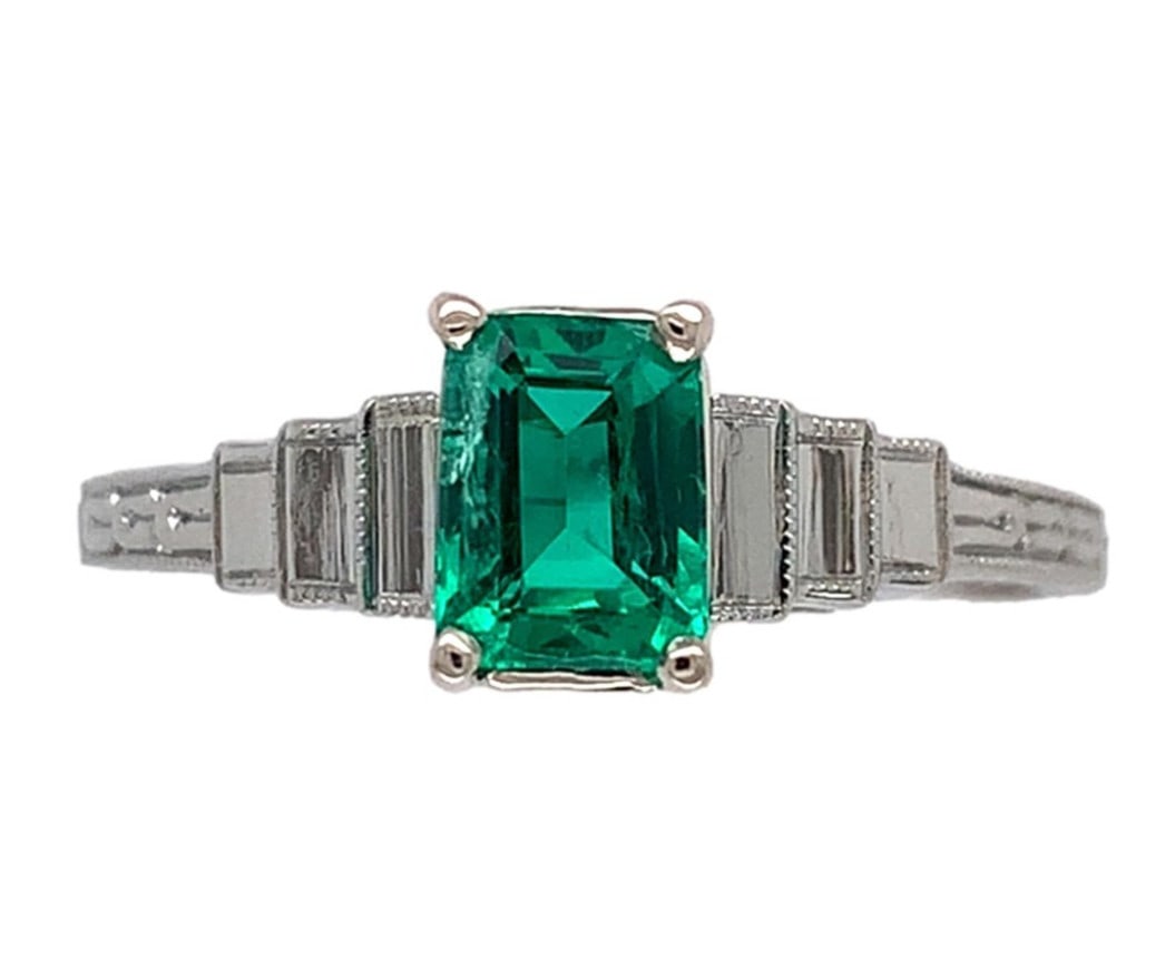 18k White Gold Art Deco .46ct Emerald Ring Size 5 Vintage: 18k White Gold Art Deco .46ct Emerald Ring Size 5 Vintage This exquisite 18k White Gold Art Deco ring showcases a stunning .46ct genuine natural emerald, beautifully set in a prong setting. The emeral