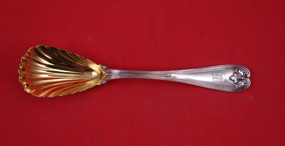 Tiffany Co Colonial Sterling Silver Preserve Serving Spoon 7 Inch: Tiffany Co Colonial Sterling Silver Preserve Serving Spoon 7 Inch Colonial by Tiffany & Co. sterling silver preserve spoon with a shell bowl and gold washed finish. It is monogrammed, with monos varyi