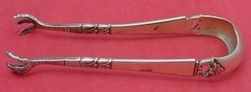 Frigast Danish Crown Sterling Silver Sugar Tong 5 1/8 Inch Serving Piece: Frigast Danish Crown Sterling Silver Sugar Tong 5 1/8 Inch Serving Piece Enhance your serving experience with the Danish Crown sugar tong by Frigast. Crafted from high-quality sterling silver, this el