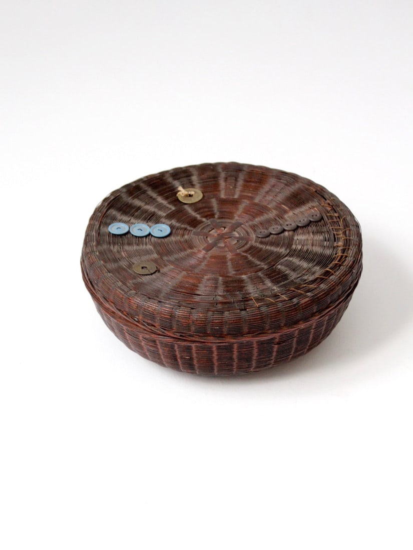 Coiled Wicker Storage Basket with Lid Vintage Chinese Design: Coiled Wicker Storage Basket with Lid Vintage Chinese Design This vintage Chinese sewing basket is crafted from coiled wicker and features a fitted lid with subtle applied details. Traditionally used 