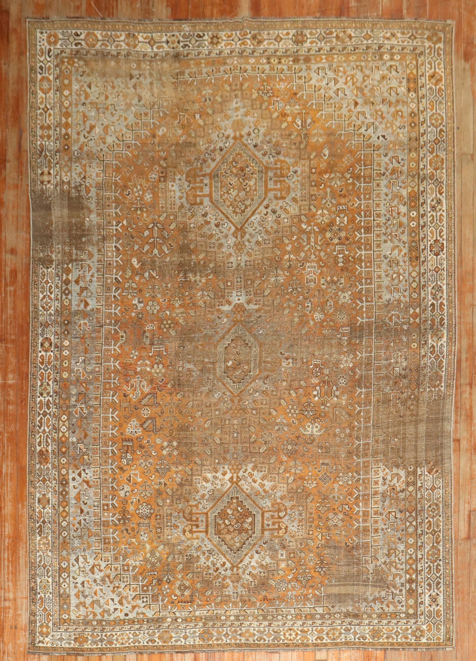 6' 9" x 10' 6" Early 20th Century Persian Shiraz Tribal Rug: 6' 9" x 10' 6" Early 20th Century Persian Shiraz Tribal Rug Early 20th century tribal Persian Shiraz distressed rug with a shabby chic style. This pre-owned room-size rug combines traditional Shiraz c
