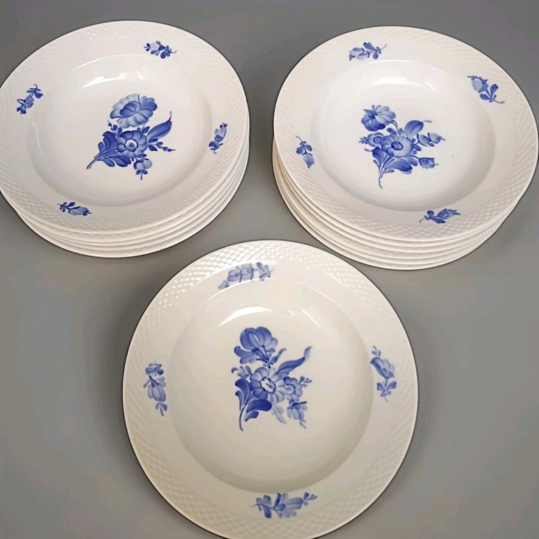 12 Royal Copenhagen Blue Flowers Braided Porcelain Bowls 8.25 in: 12 Royal Copenhagen Blue Flowers Braided Porcelain Bowls 8.25 in Set of 12 Royal Copenhagen Blue Flowers Braided round bowls in the 8105 pattern. These vintage porcelain bowls feature a blue floral de