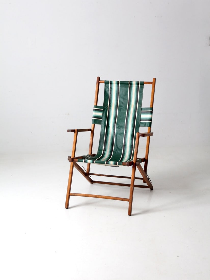 Mid-Century Folding Deck Chair with Green Striped Canvas: Mid-Century Folding Deck Chair with Green Striped Canvas This mid-century deck chair is a stylish addition to your outdoor space. Featuring a bold green striped canvas, this classic wood frame beach c