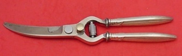 Reed & Barton Jubilee 10 Inch Sterling Silver Lobster Shears: Reed & Barton Jubilee 10 Inch Sterling Silver Lobster Shears Enhance your dining experience with these Jubilee lobster shears by Reed & Barton. Crafted from sterling silver, these shears feature a hol