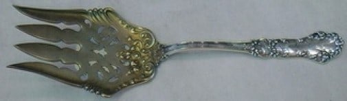 Watson Oakland Sterling Silver Pierced Vegetable Serving Fork 7 1/2 in: Watson Oakland Sterling Silver Pierced Vegetable Serving Fork 7 1/2 in Sterling silver vegetable serving fork in the Oakland pattern by Watson, featuring a pierced fancy design and goldwashed finish. 
